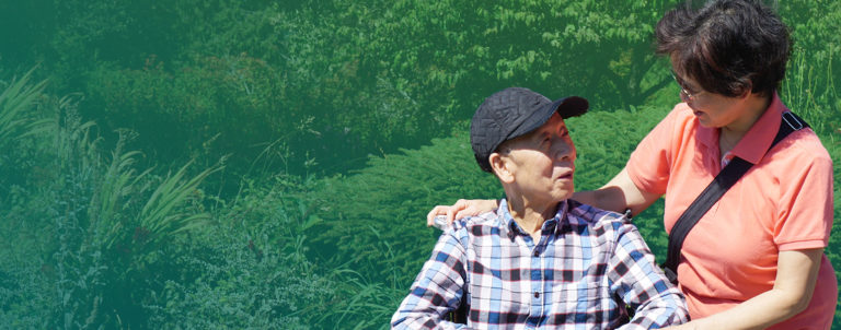 Stroke survivor and caregiver couple looking at each other lovingly