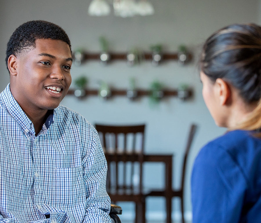 Man discussing stroke home care with After Stroke staff