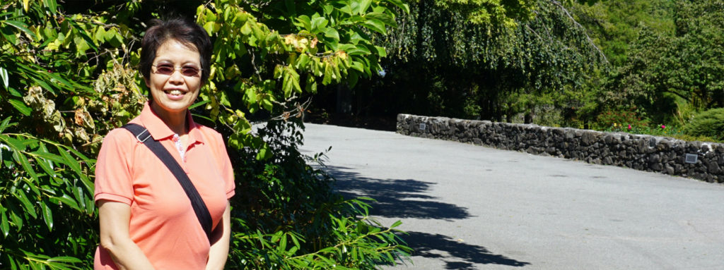 smiling Anita by a path in the park